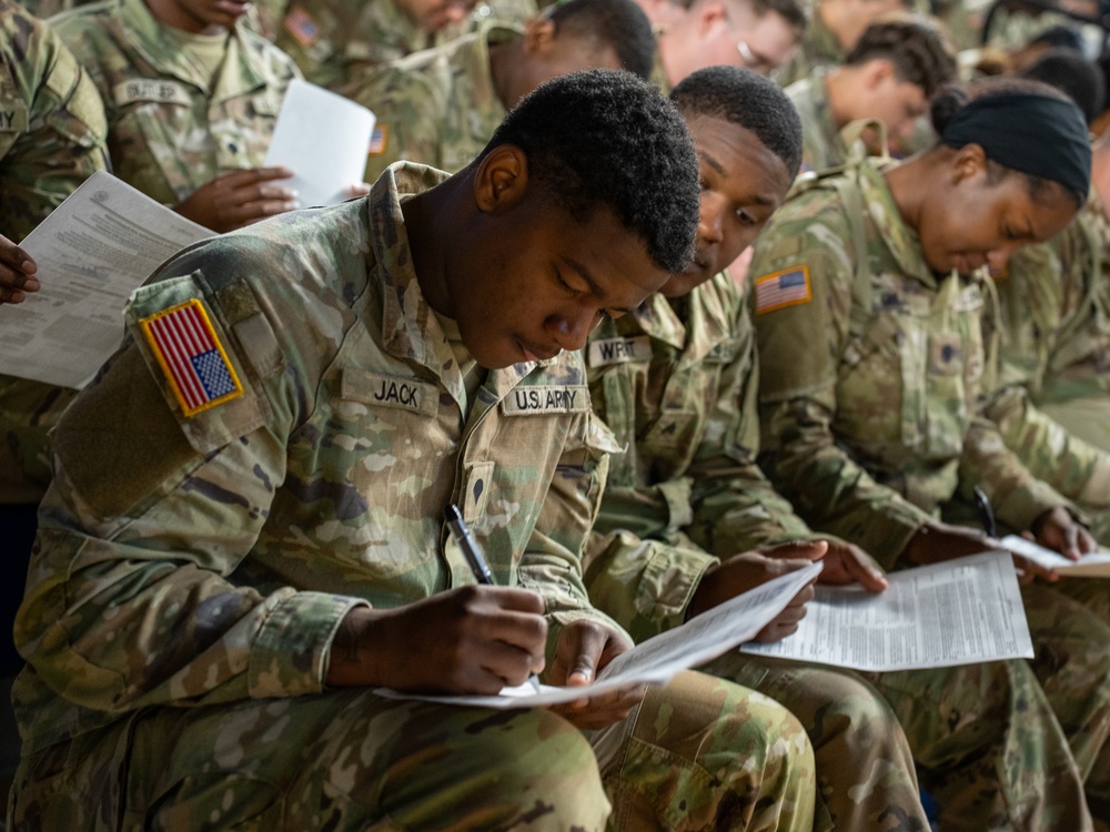 Soldiers with the 256th Infantry Brigade Combat Team receive an initial briefing and are sworn in for deputization