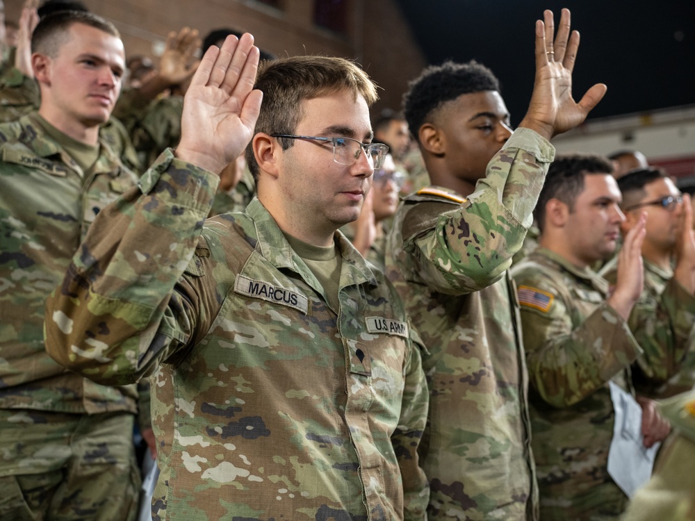 Soldiers with the 256th Infantry Brigade Combat Team receive an initial briefing and are sworn in for deputization