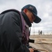 FC2 Eddie Hernandezmota stows the pilot ladder on the flight deck