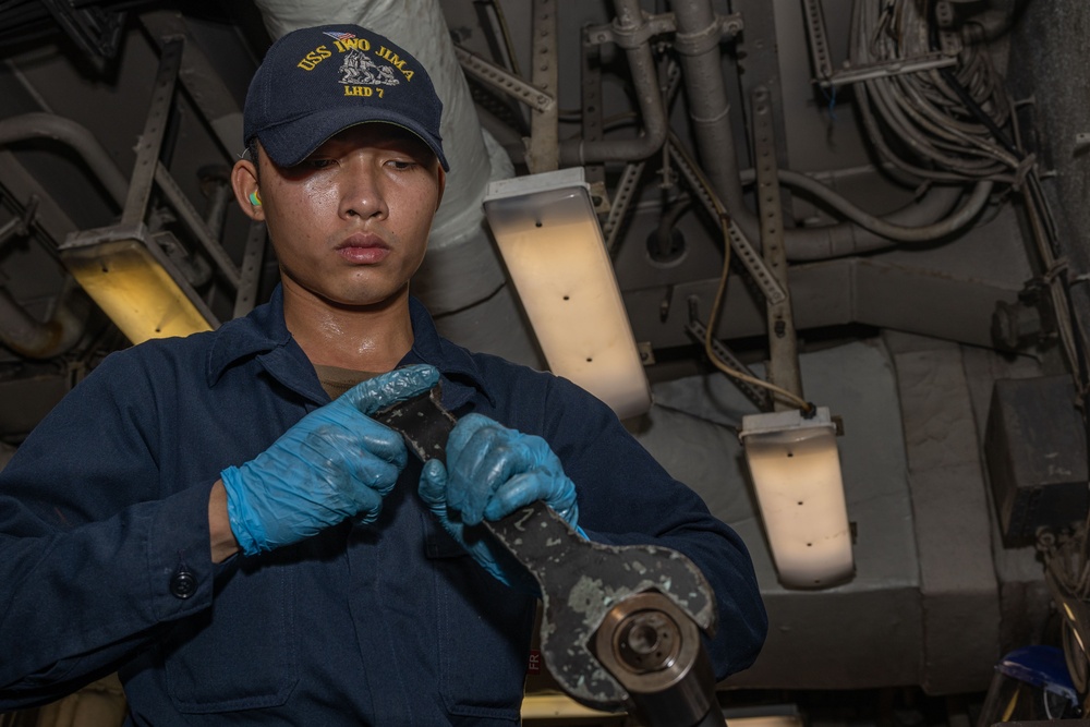 USS Iwo Jima (LHD 7) Sailor Assembles a Burner Barrel