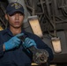 USS Iwo Jima (LHD 7) Sailor Assembles a Burner Barrel