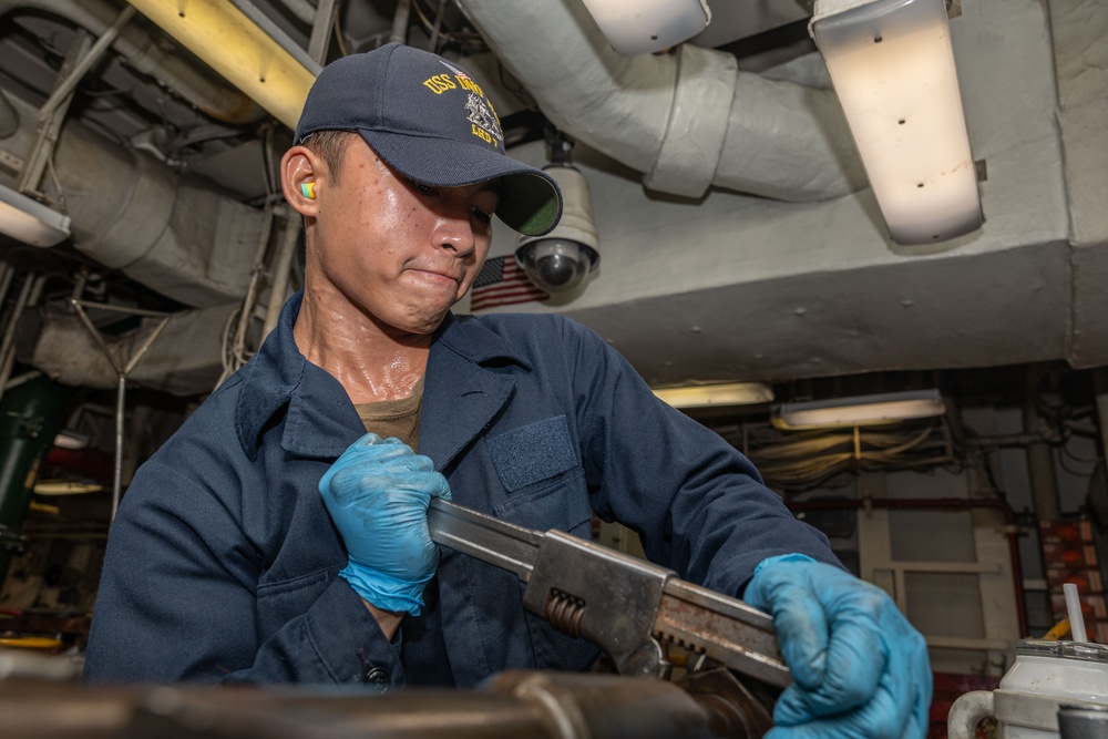 USS Iwo Jima (LHD 7) Sailor Assembles a Burner Barrel