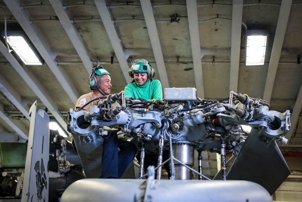USS Iwo Jima Sailors Conduct Maintenance on a MH-60S
