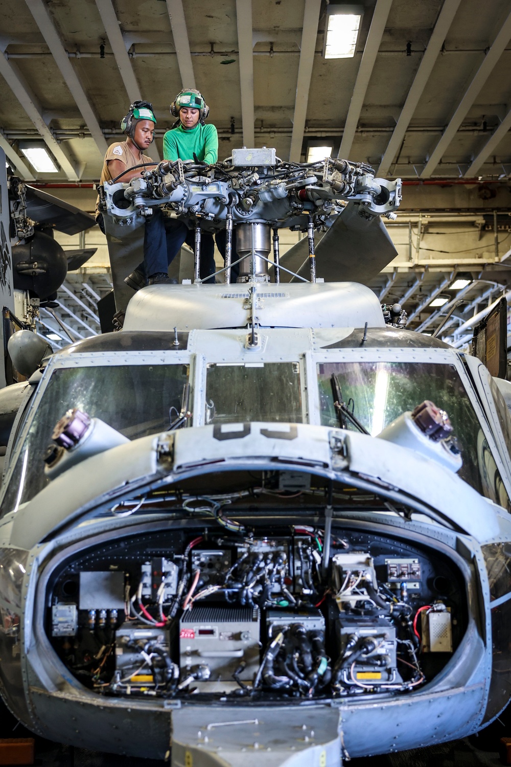 USS Iwo Jima Sailors Conduct Maintenance on a MH-60S