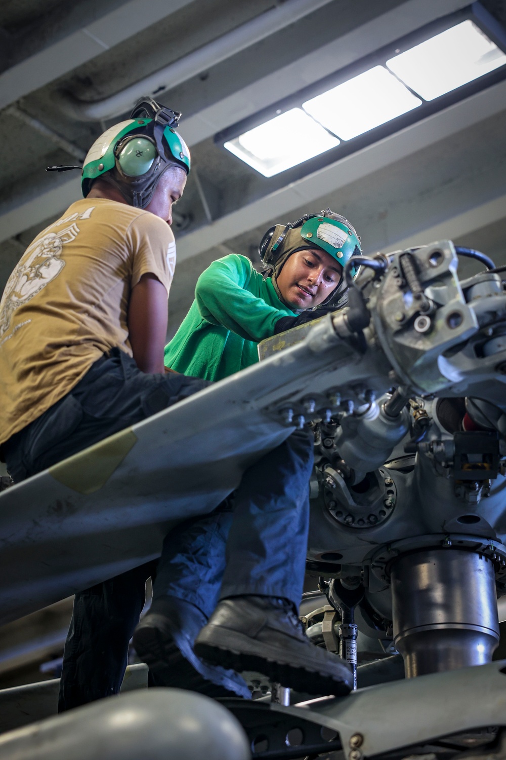 USS Iwo Jima Sailors Conduct Maintenance on a MH-60S