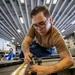 USS Iwo Jima Sailor Maintains Aircraft Equipment