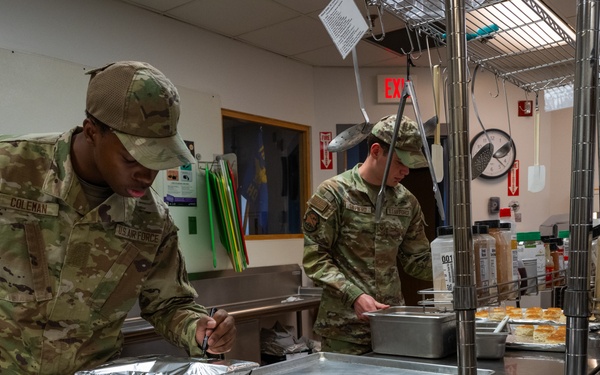 181st Force Support Squadron prepare and serve meals in DFAC