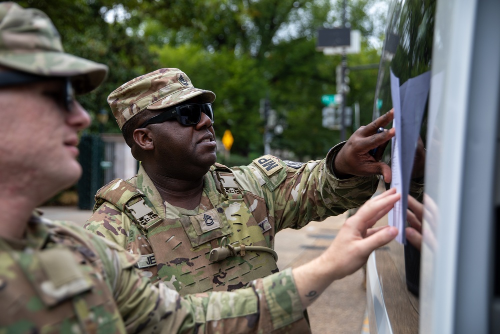 A Mississippi National Guard Soldier reviews meal distribution paperwork