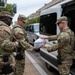 Mississippi National Guard Soldiers receive food while on patrol in Washington, D.C.