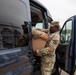 A Mississippi National Guard Soldier loads food for troops on patrol in Washington, D.C.