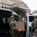 Mississippi National Guard Soldiers deliver food in front of the National Archives Building