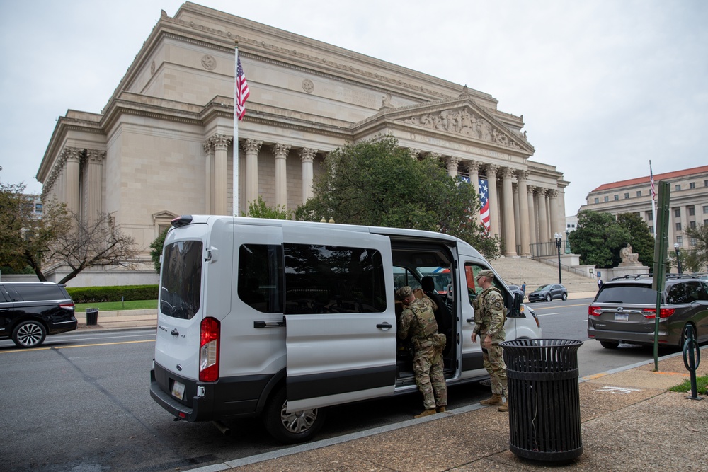 Mississippi National Guard Soldiers deliver food in front of the National Archives Building