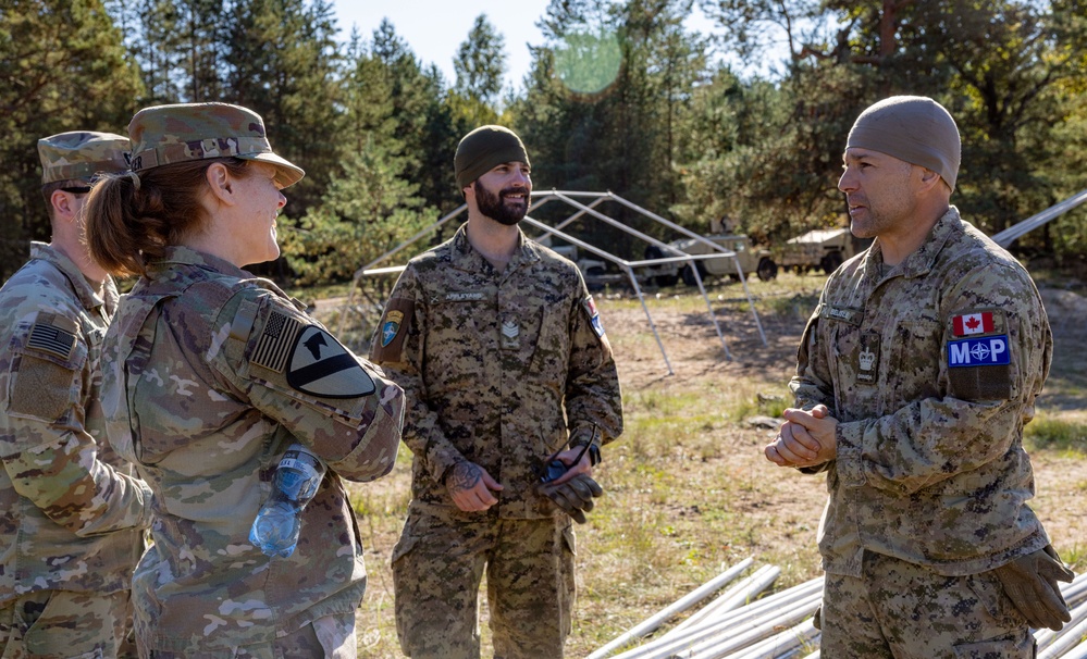 Canadian Forces and U.S. Army military police forces talk about detainee operations in Latvia Canadian Forces and U.S. Army military police forces talk about detainee operations in Latvia