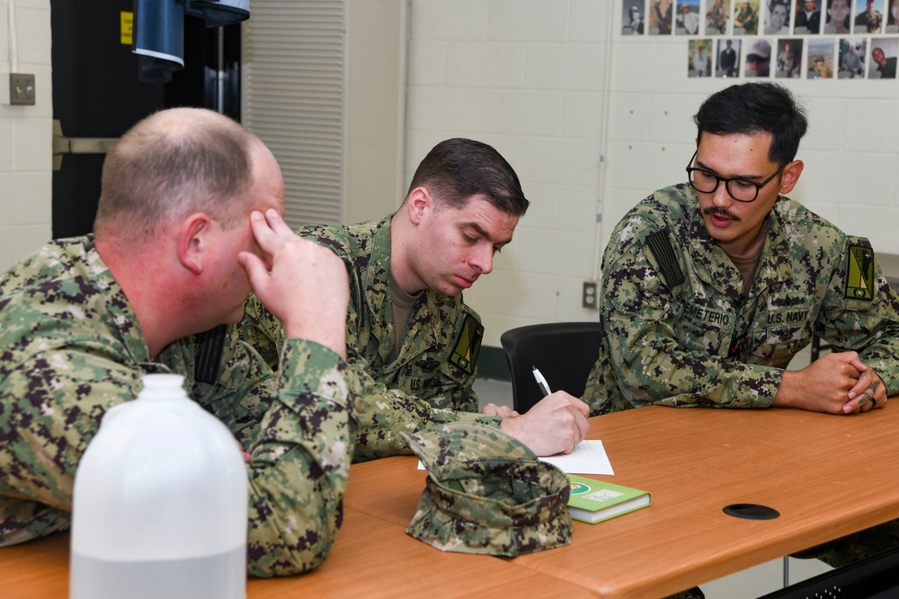 Sailors hold professional military education workshop