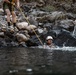 U.S. service members and German soldiers conduct stream crossing exercises during Mountain Medicine 3-25 