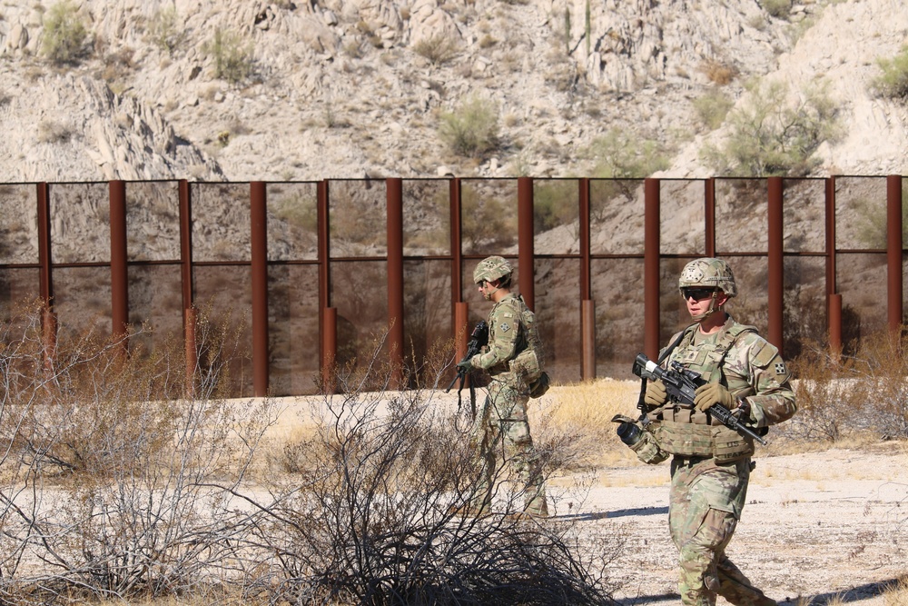 U.S. Soldiers and Marines conduct National Defense Area sign emplacement