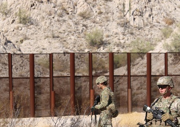 U.S. Soldiers and Marines conduct National Defense Area sign emplacement