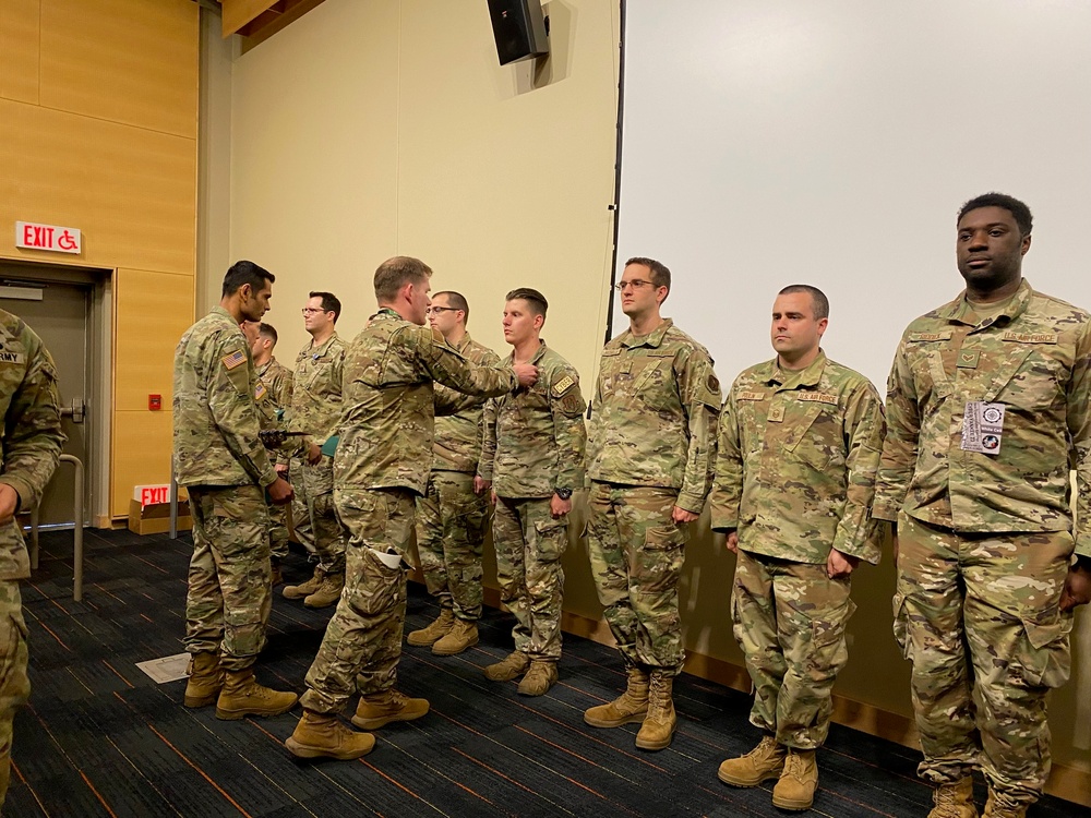 Lt. Col. Cameron Sprague, presents the Army Achievement Medal
