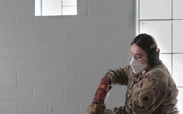 National Guardsmen remove old furniture and build new furniture for Capital Guardian Youth ChalleNGe Academy