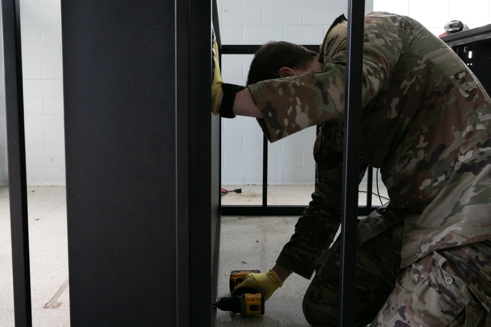 National Guardsmen remove old furniture and build new furniture for Capital Guardian Youth ChalleNGe Academy