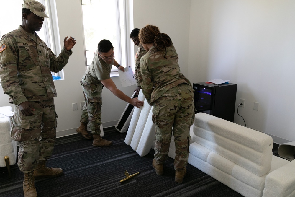 National Guardsmen remove old furniture and build new furniture for Capital Guardian Youth ChalleNGe Academy