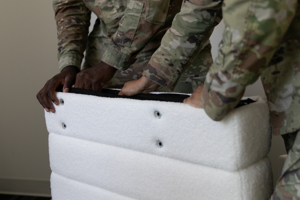 National Guardsmen remove old furniture and build new furniture for Capital Guardian Youth ChalleNGe Academy