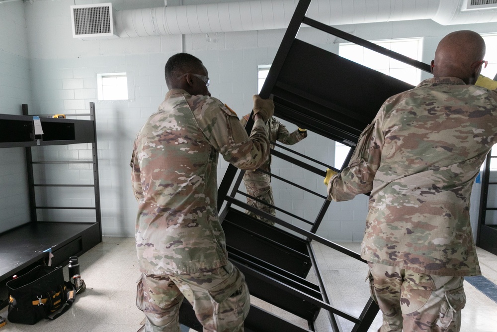 National Guardsmen remove old furniture and build new furniture for Capital Guardian Youth ChalleNGe Academy