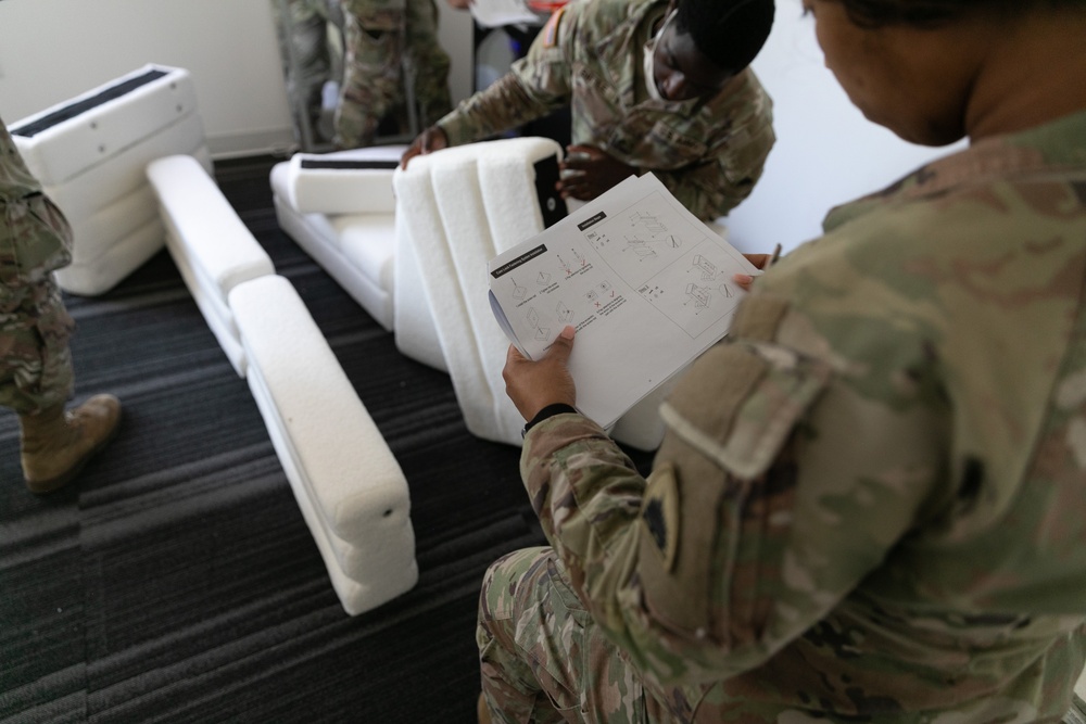 National Guardsmen remove old furniture and build new furniture for Capital Guardian Youth ChalleNGe Academy