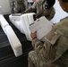 National Guardsmen remove old furniture and build new furniture for Capital Guardian Youth ChalleNGe Academy