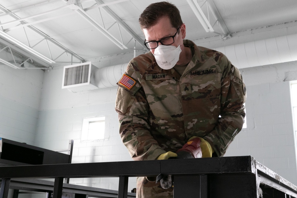 National Guardsmen remove old furniture and build new furniture for Capital Guardian Youth ChalleNGe Academy