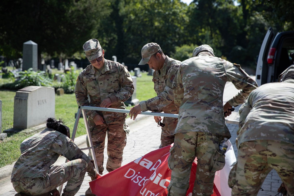 U.S. Service Members with the District of Columbia National Guard Help Volunteers at Special Olympics