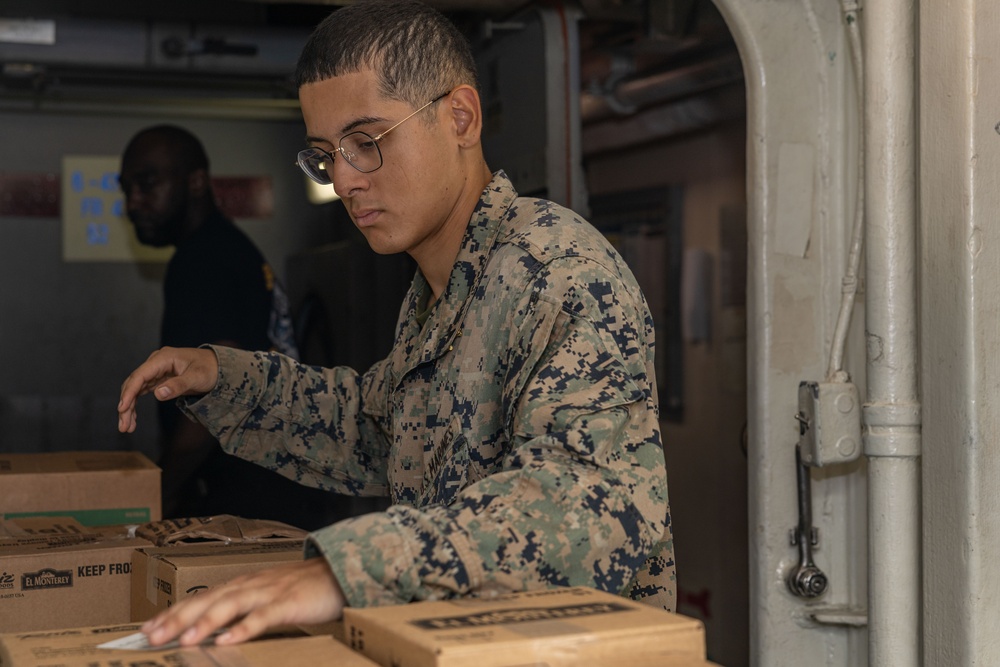 Sailors and Marines Take Part In a Replinshment-At-Sea on Board USS Iwo Jima (LHD 7)