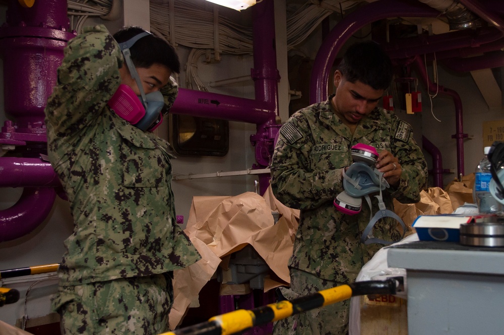 USS Ronald Reagan Sailors Paint Pump Room