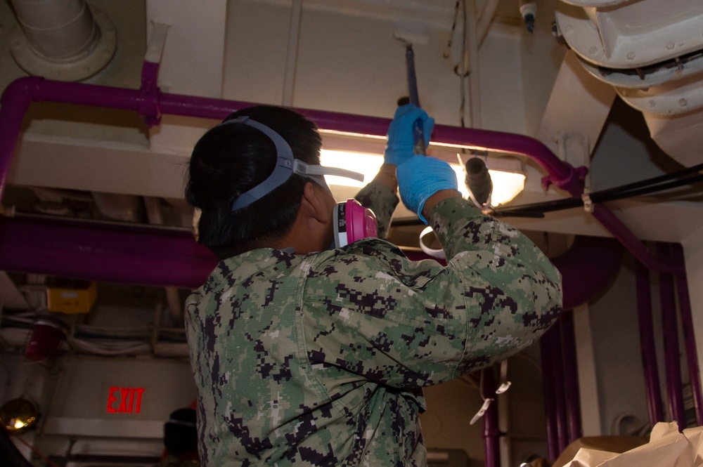 USS Ronald Reagan Sailors Paint Pump Room