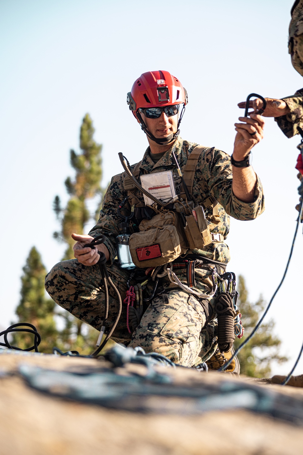 U.S. service members and German soldiers conduct repelling exercises during Mountain Medicine 3-25