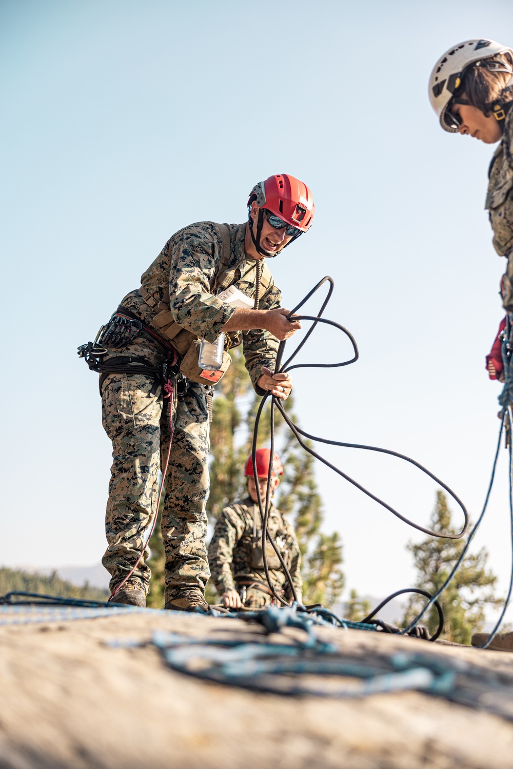 U.S. service members and German soldiers conduct repelling exercises during Mountain Medicine 3-25