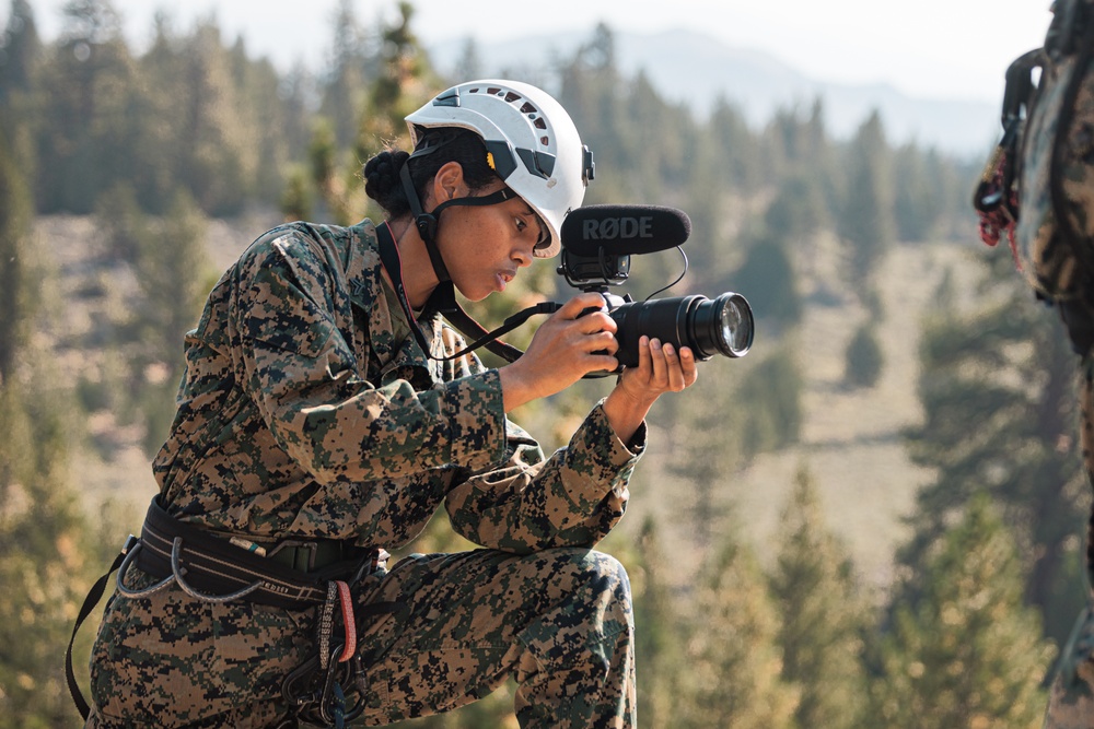 U.S. service members and German soldiers conduct repelling exercises during Mountain Medicine 3-25
