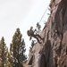 U.S. service members and German soldiers conduct repelling exercises during Mountain Medicine 3-25
