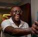 Mississippi National Guard Soldier smiles as he receives laundry bags