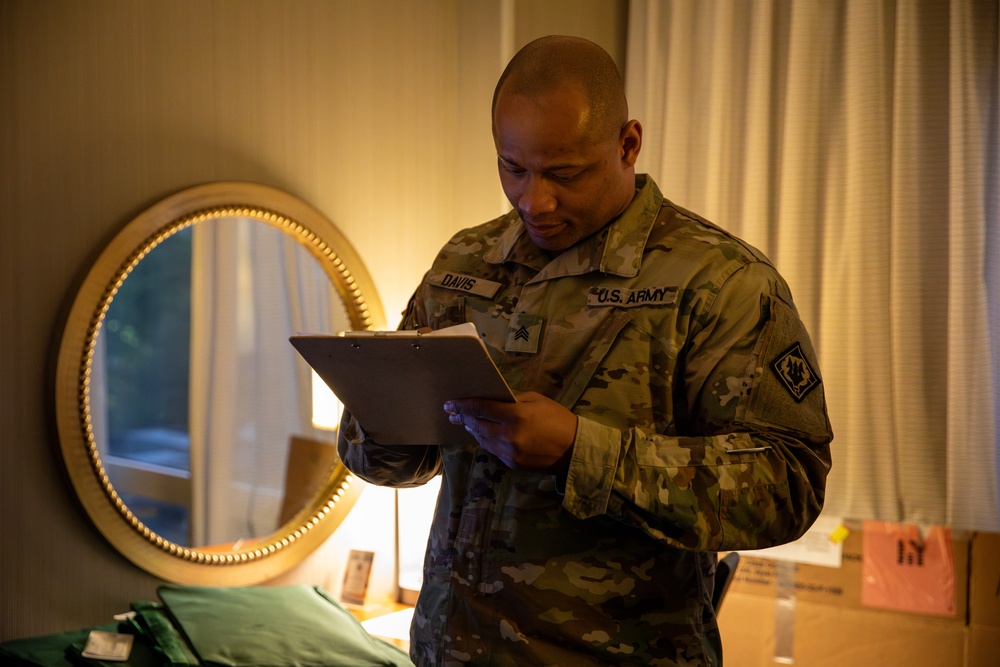 Mississippi National Guard Soldier verifies laundry bag signatures