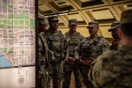 Mississippi National Guard Troops receive a brief while patrolling the Washington Metro