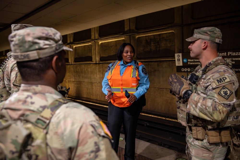 Mississippi National Guard Soldiers talk to WMATA police in the Washington Metro