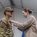 U.S. Army Soldier receives the Medal of the National Defense System of the Republic of Lithuania during a transfer of authority ceremony