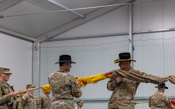 U.S. Army Soldiers conduct a color uncasing ceremony during a transfer of authority ceremony in Lithuania