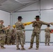 U.S. Army Soldiers conduct a color uncasing ceremony during a transfer of authority ceremony in Lithuania