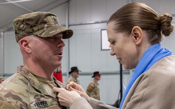 U.S. Army Soldier receives the Medal of the National Defense System of the Republic of Lithuania during a transfer of authority ceremony