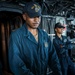 USS Iwo Jima Sailor Stands Watch as the Helmsman