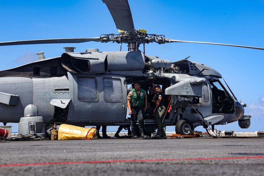 Sailors And U.S. Marines on the Flight Deck of USS Iwo Jima