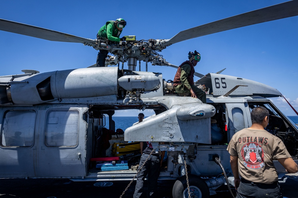 USS Iwo Jima Sailors Conduct Maintenance on a MH-60S