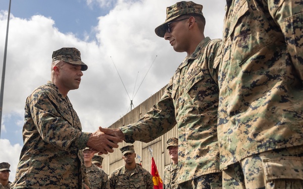 MRF-D 25.3: U.S. Marines participate in MAGTF group photo and coining ceremony